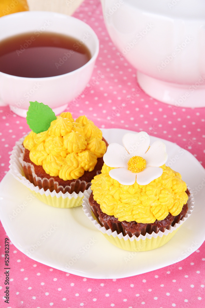 Beautiful lemon cupcakes on dining table close-up Beautiful lemon cupcakes on dining table close-up