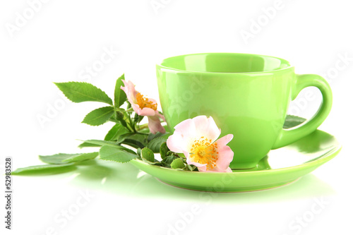 Fototapeta Naklejka Na Ścianę i Meble -  Cup of herbal tea with hip rose flowers, isolated on white