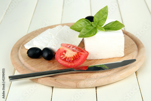 Sheep milk cheese, black olives, red tomato with basil