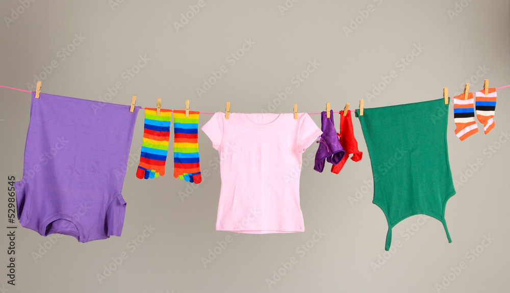 Laundry line with clothes on wall background Laundry line with clothes on wall background