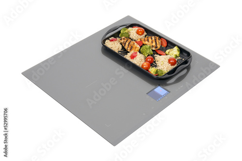 Grey glass induction hob with clipping path.