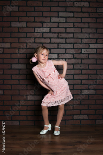 Elegant girl in a pink dress