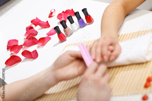 Woman is getting manicure