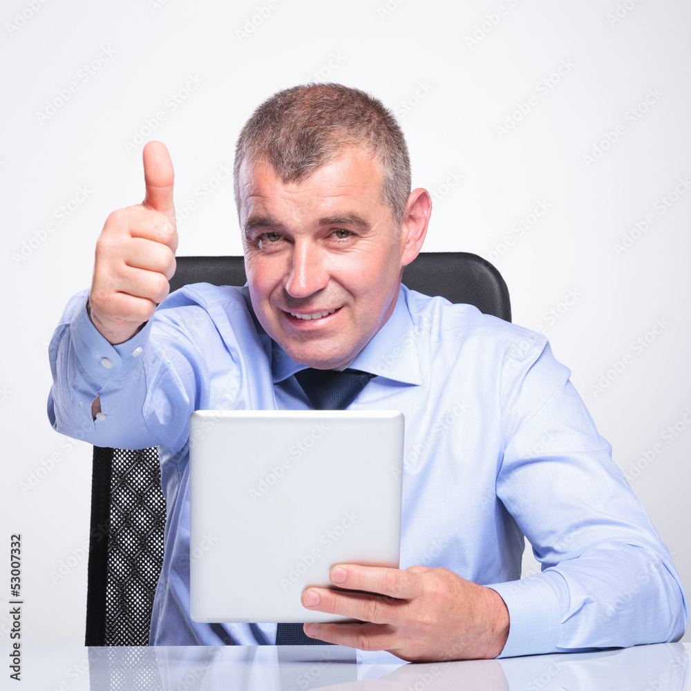 old business man with pad shows thumb up old business man with pad shows thumb up