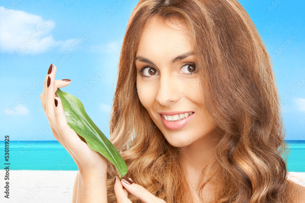 Naklejka premium woman with green leaf
