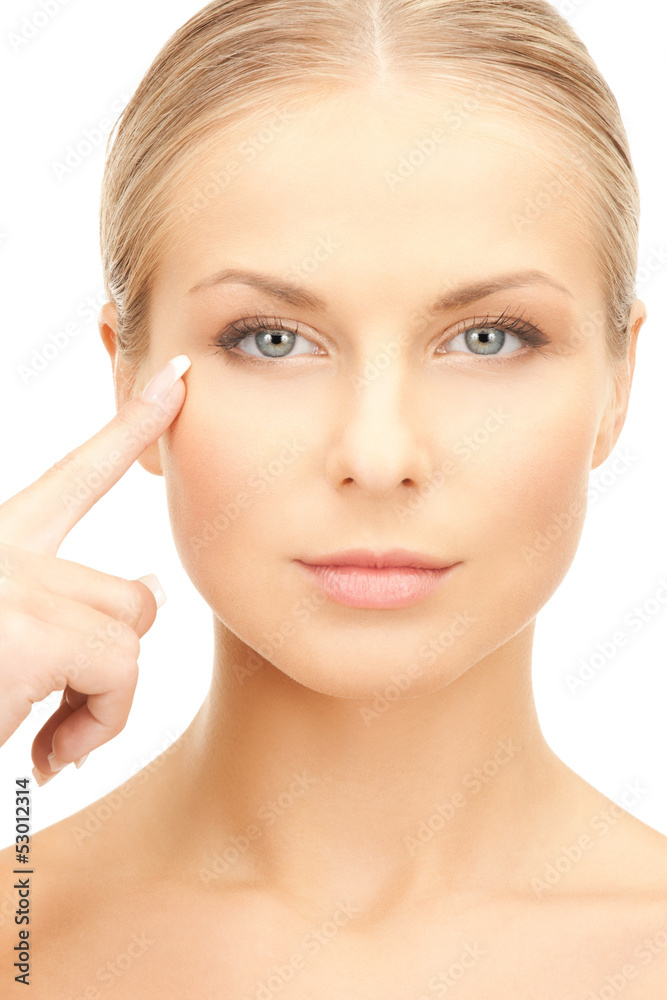 woman pointing at her eye area