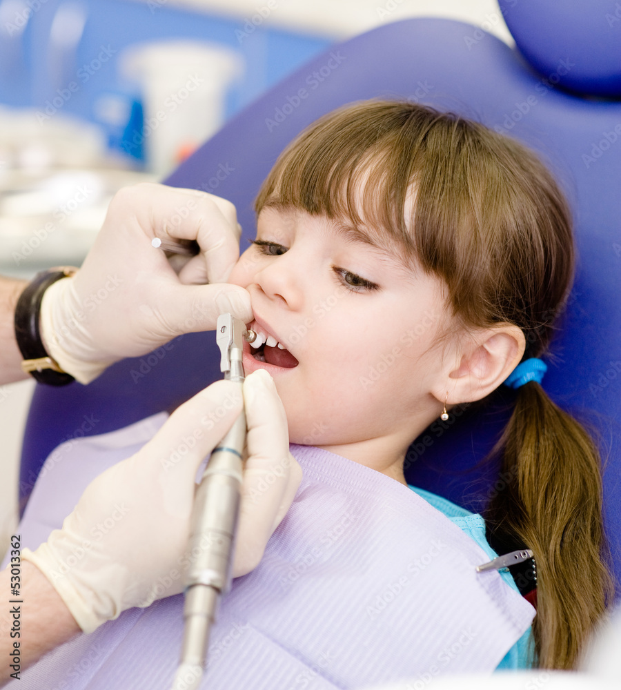 little girl with open mouth during drilling treatment little girl with open mouth during drilling treatment