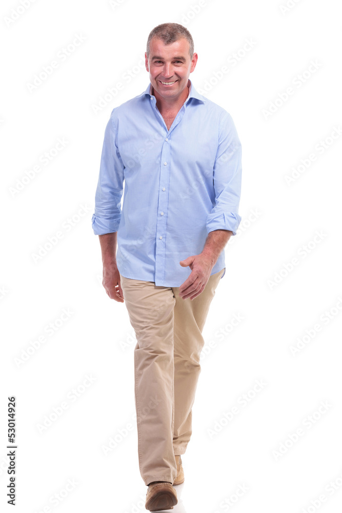 casual middle aged man walks to the camera casual middle aged man walks to the camera