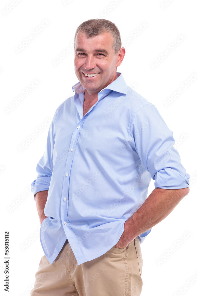 casual middle aged man with hands in pockets casual middle aged man with hands in pockets