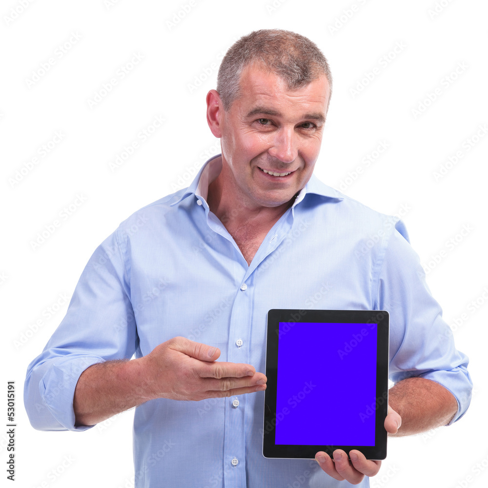 casual middle aged man presenting tablet casual middle aged man presenting tablet