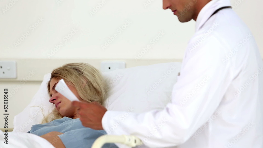 Doctor reading a document to a patient Doctor reading a document to a patient