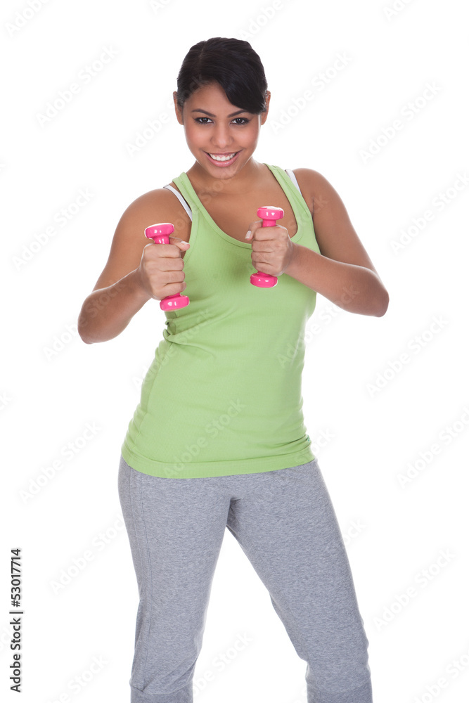 Young Woman Exercising With Dumbbells Young Woman Exercising With Dumbbells
