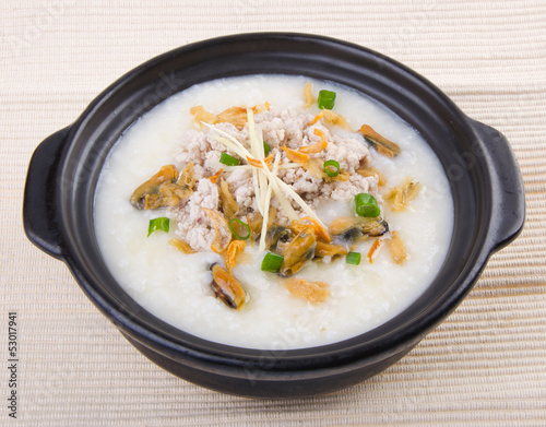 Obraz na płótnie Traditional chinese pork porridge rice gruel served in claypot