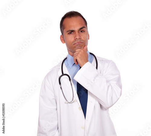 Pensive medical doctor looking at you