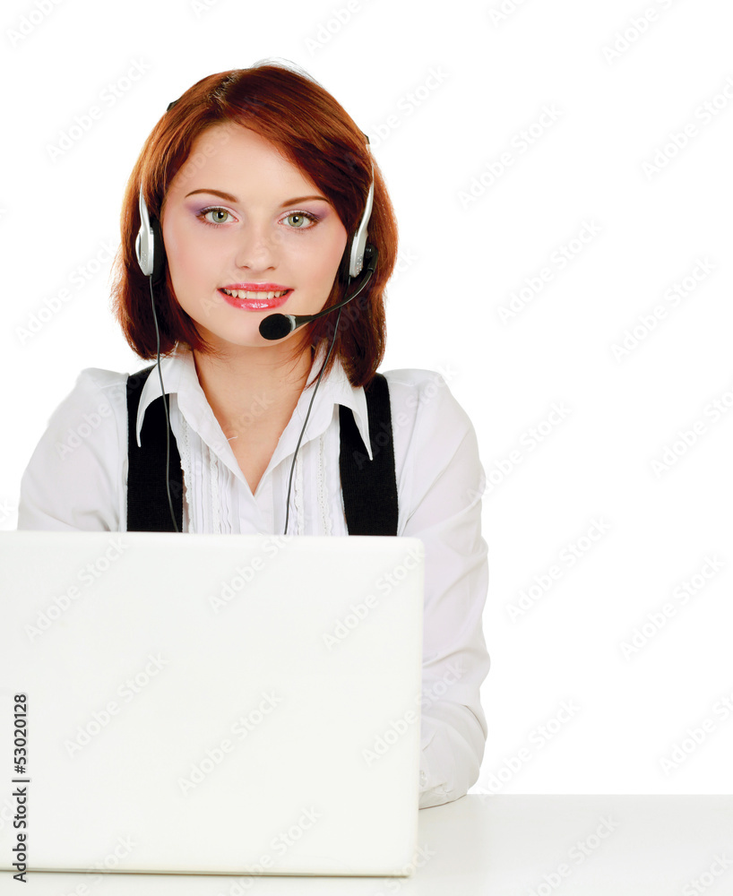 A young customer service girl with a headset at her workplace A young customer service girl with a headset at her workplace