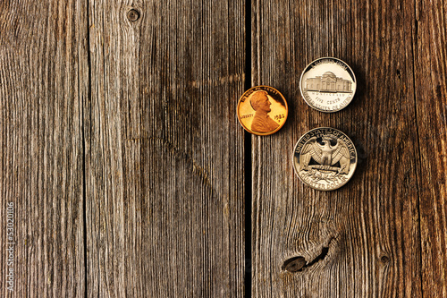 US cent coins over wooden background