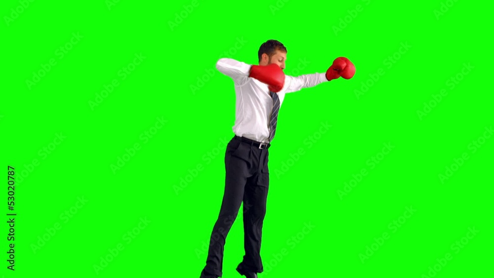 Businessman jumping with boxing gloves and punching Businessman jumping with boxing gloves and punching