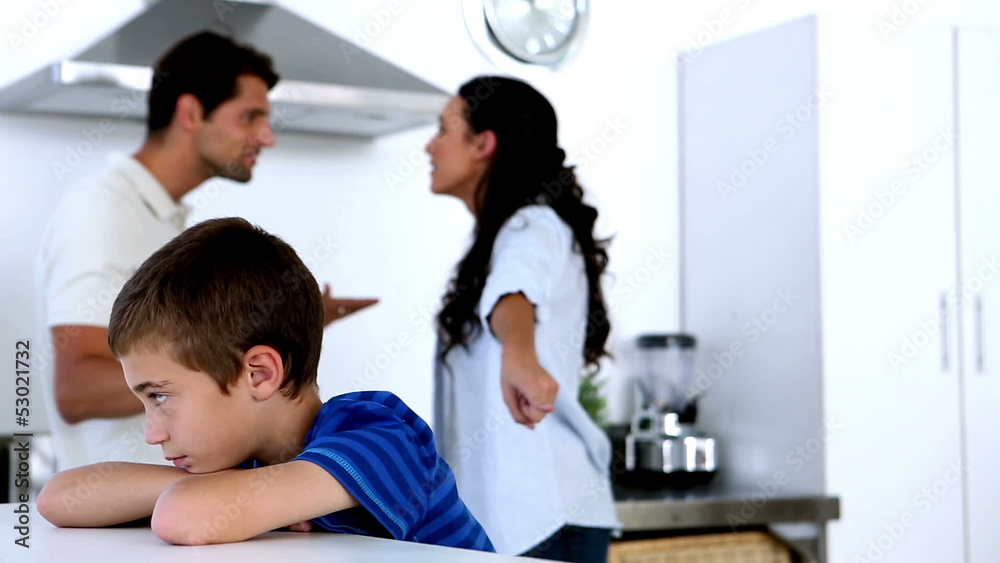 Little boy feeling sad as parents fight