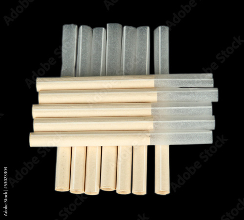 Empty cigarette tubes  isolated on black
