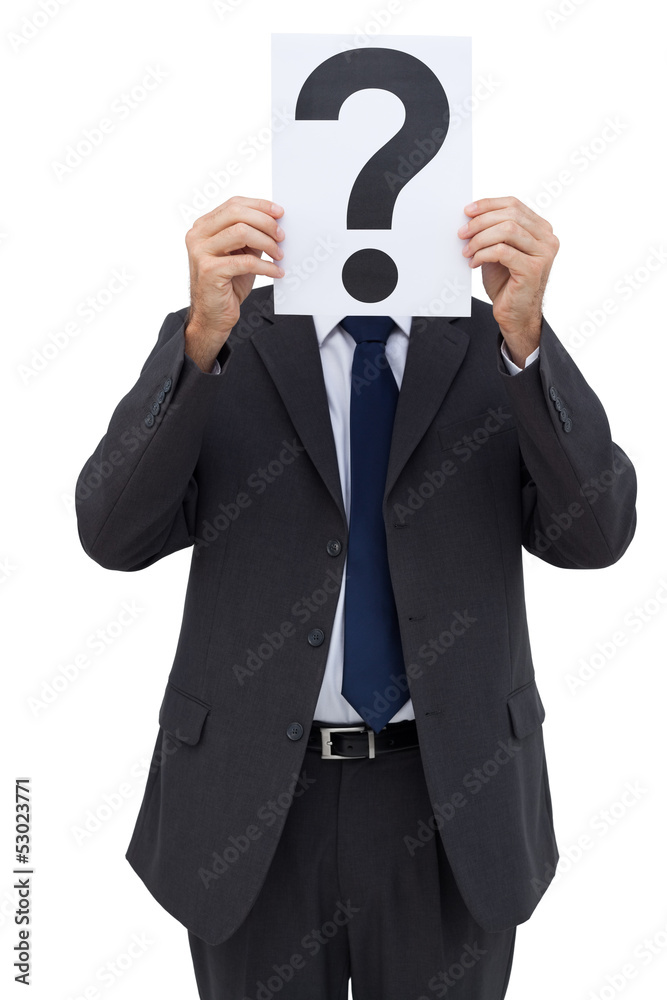 Businessman holding a question mark paper in front of his face Businessman holding a question mark paper in front of his face