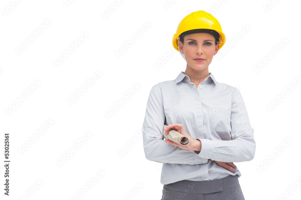 Architect woman with yellow helmet and rolled up plan Architect woman with yellow helmet and rolled up plan