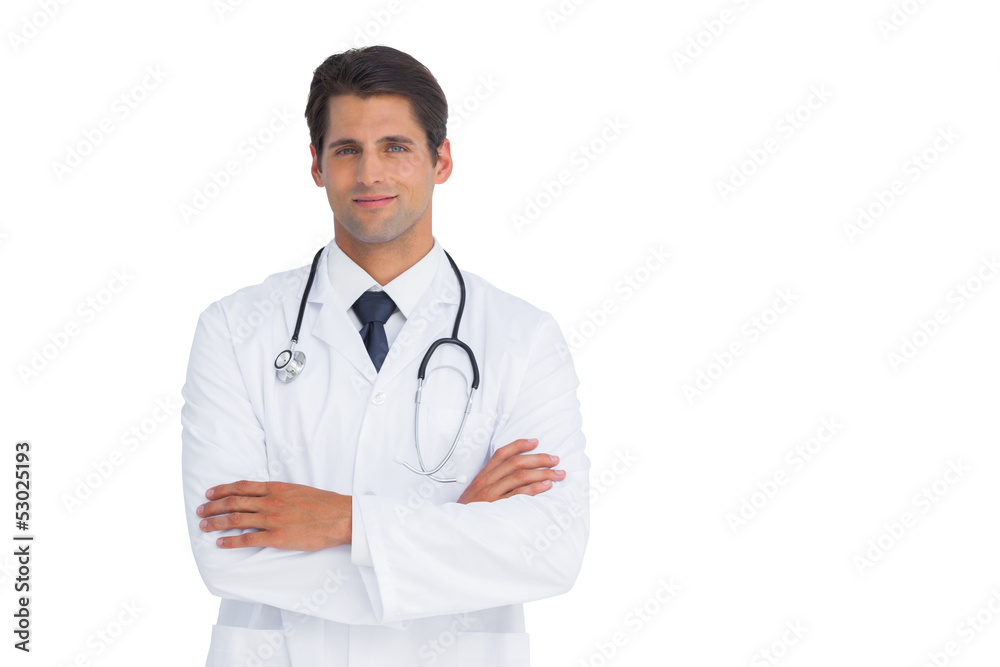 Attractive doctor smiling with arms crossed Attractive doctor smiling with arms crossed