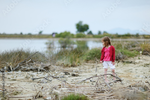 Little girl on Tigaki lake beach © MNStudio