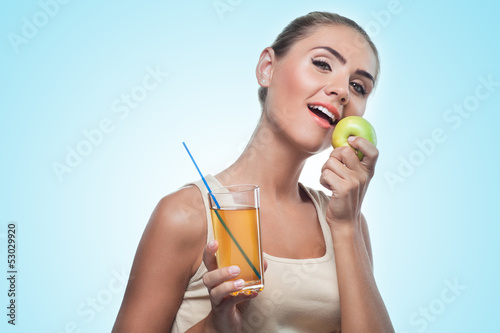 Happy Young Woman with apple juice