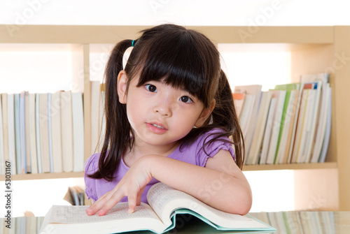 Asian girl reading book