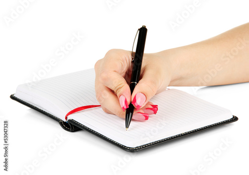 Hand signing in notebook, isolated on white