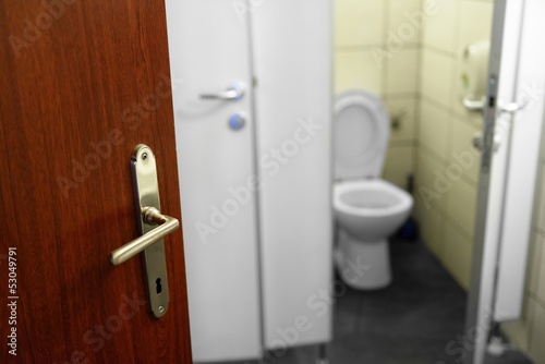 Opened door with toilet