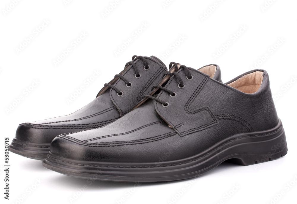 Black glossy man’s shoes with shoelaces