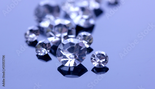 Beautiful shining crystals  diamonds   on purple background