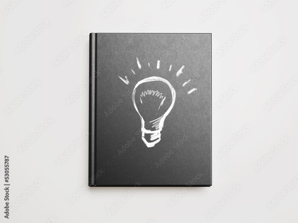 idea bulb sign drawn on book cover idea bulb sign drawn on book cover