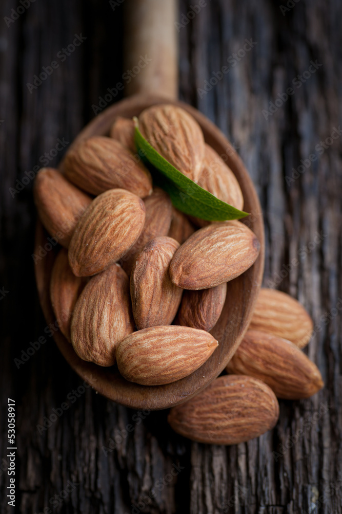Almonds on a wooden spoon Almonds on a wooden spoon