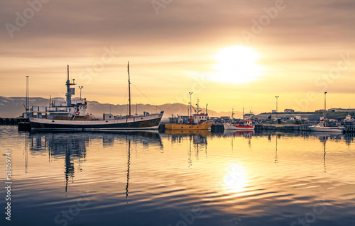 Ships lying in the harbor of Husavik at sunset, Iceland © JFL Photography