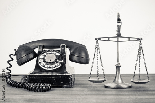Bild auf Leinwand Retro old telephone and scales on wood table sepia photo