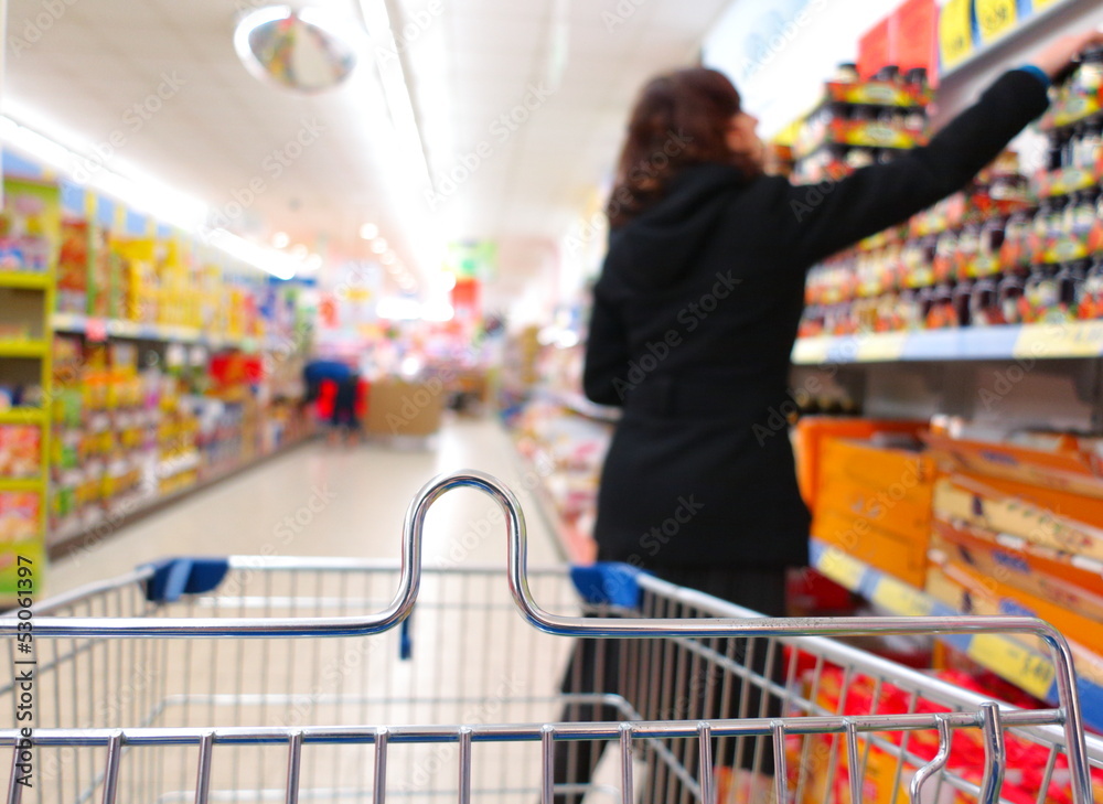 Woman at the supermarket with trolley