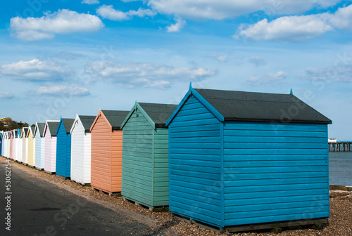 Colourful beach huts on sunny beach