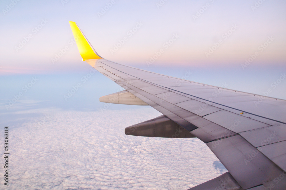 Obraz premium Clouds and sky as seen through window of an aircraft in night
