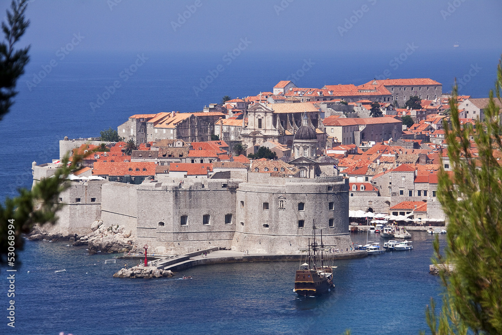 View of walled Dubrovnik old town with harbor, Croatia