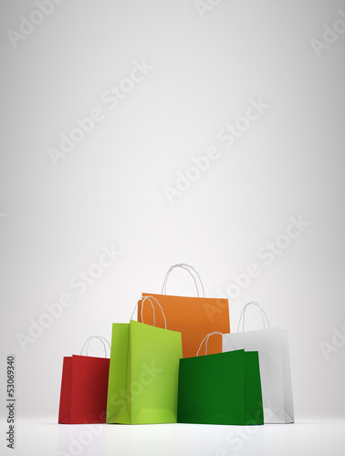 Colorful paper shopping bags on white