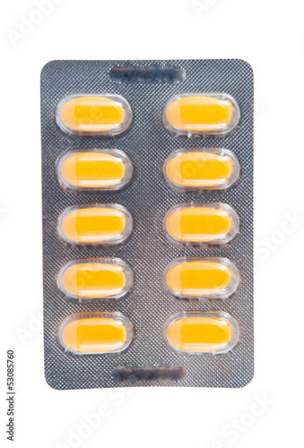 Yellow tablet in transparent blister pack