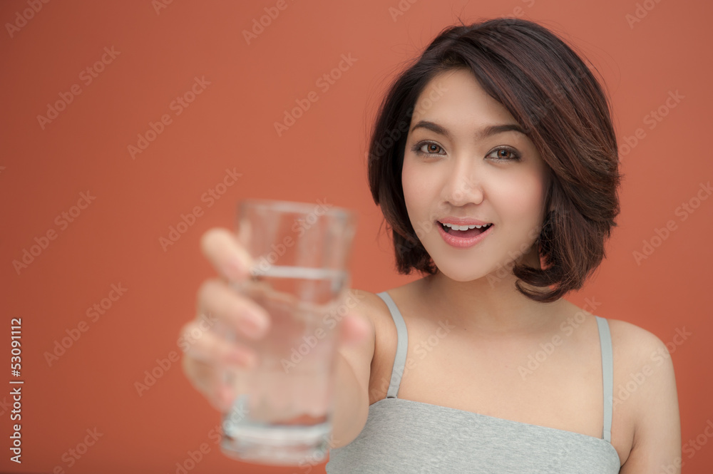 young woman holding glass of drinking water young woman holding glass of drinking water