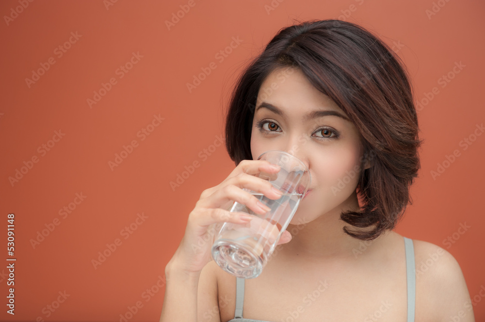 young woman drinking water with text space young woman drinking water with text space