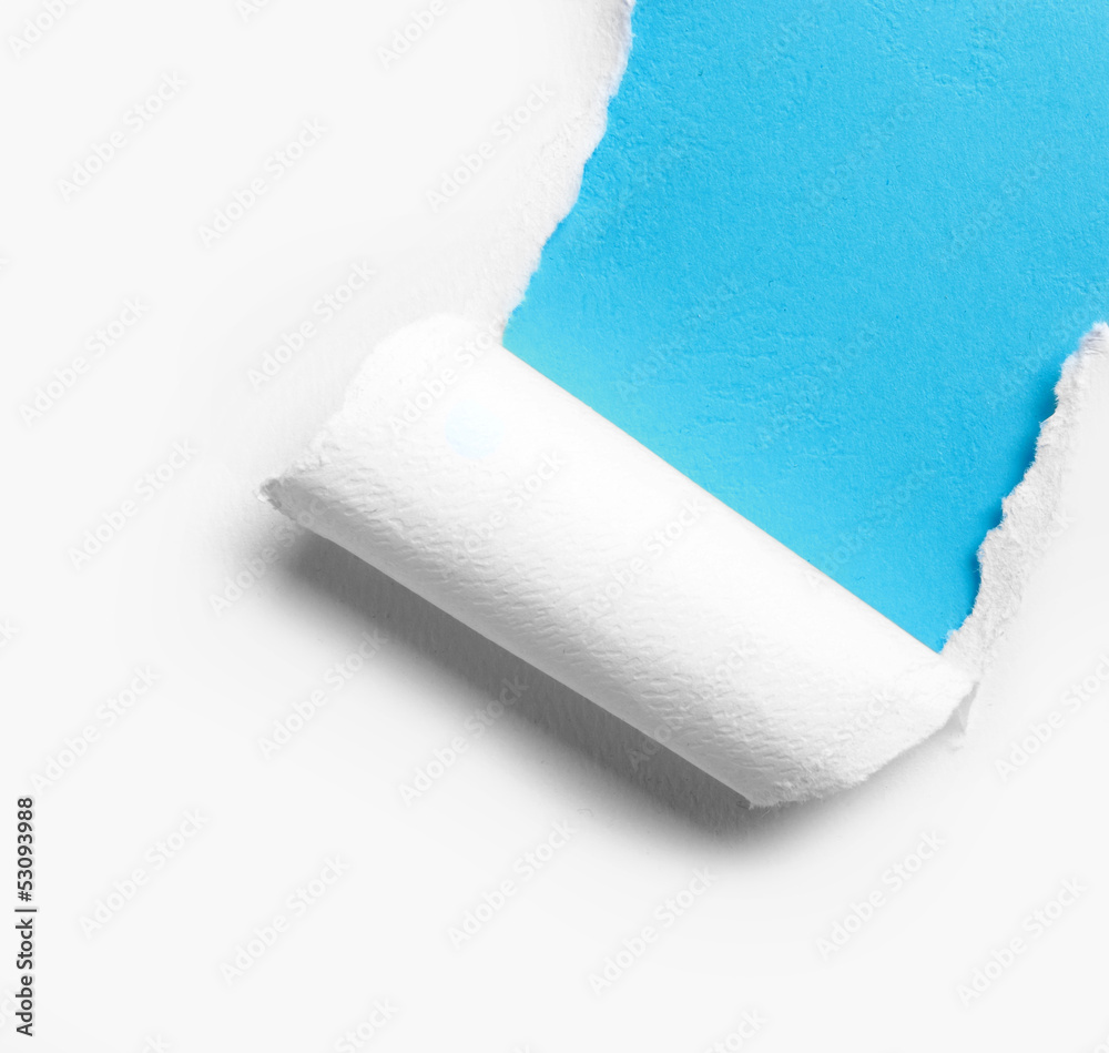 Obraz premium corner white torn paper with blue background