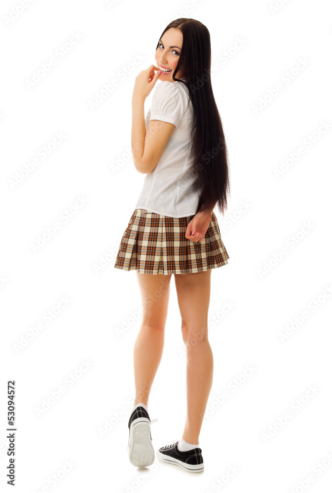 Fototapeta premium Modest girl in plaid skirt