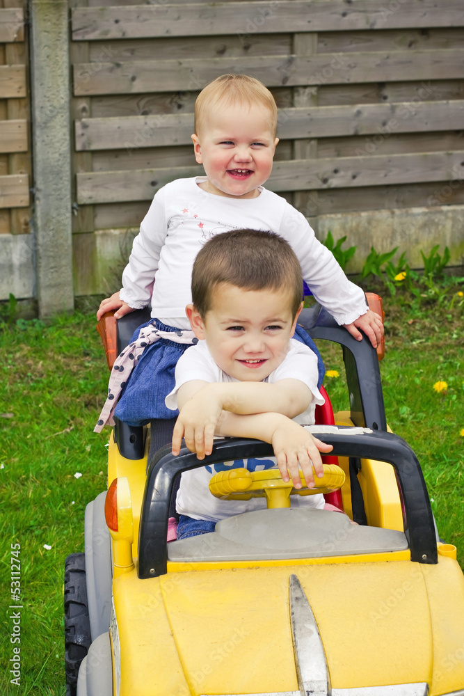 Children in toy car
