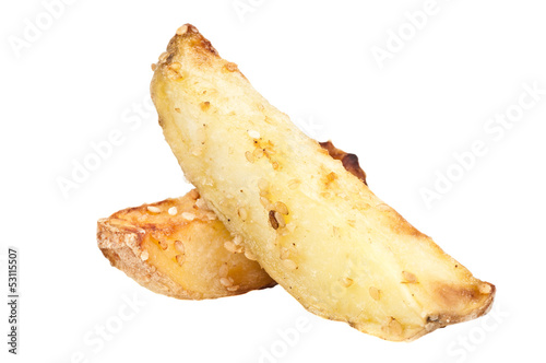 Sliced baked potatoes with sesame over a white background