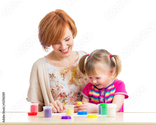 mother and daughter play with dough